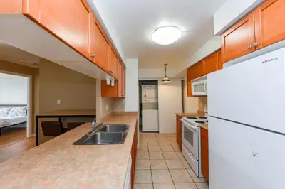 a kitchen with a sink and a counter top at PlanURstay - Amazing 2BR & 2BTH - Near Square One Mall in Mississauga