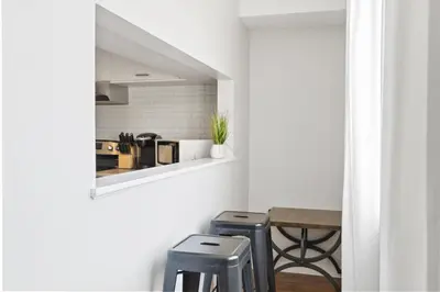a kitchen with two stools and a table at Mountain View Wintergreen Home 84140 in Blue Mountains