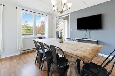 a dining room with a wooden table and chairs at Mountain View Wintergreen Home 84140 in Blue Mountains