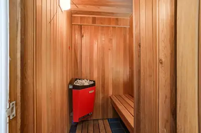 a small sauna with a red trash can in it at Mountain View Wintergreen Home 84140 in Blue Mountains