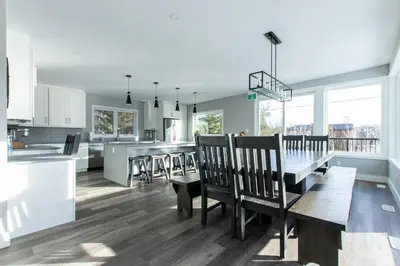 a kitchen and dining room with a table and chairs at 107 Birchview Trail in Blue Mountains