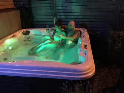 a man and a child sitting in a hot tub at Love-nest With Private Hot Tub in Toronto