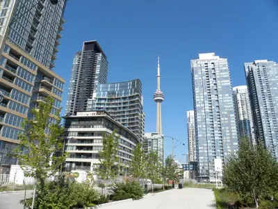 a city with tall buildings and the cn tower at Elegant Downtown Condo Near CN Tower -FREE Parking in Toronto