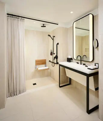 a bathroom with a sink and a shower at The Pearle Hotel & Spa, Autograph Collection in Burlington