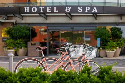 two bikes parked in front of a hotel and spa at The Pearle Hotel & Spa, Autograph Collection in Burlington