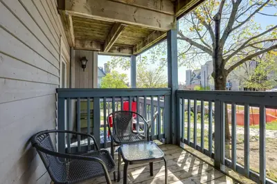 a porch with two chairs and a table at Blue Mountain Studio Oasis in Blue Mountains
