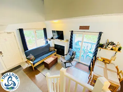 a living room with a couch and a chair at Cozy Studio Loft with 2 Baths Next to Slopes in Blue Mountains