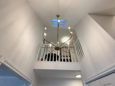 a chandelier in a room with a ceiling at The Promenade Cottage License # 002-2023 in Niagara on the Lake