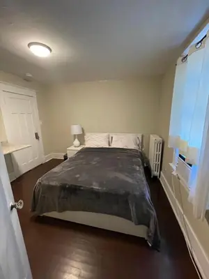 a bedroom with a large bed in a room at House in Niagara falls, Close to Clifton Hill, Casino and Horseshoe falls and with kitchen for 6 Guest in Niagara Falls