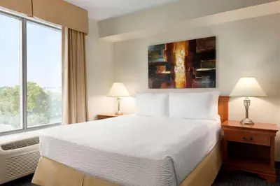 a hotel room with a bed and a large window at Days Inn by Wyndham Niagara Falls Centre St By the Falls in Niagara Falls