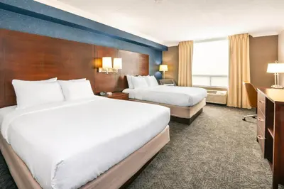 a hotel room with two beds and a window at Comfort Inn & Conference Centre Toronto Airport in Toronto