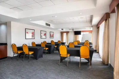 a conference room with chairs and tables and a podium at Comfort Inn & Conference Centre Toronto Airport in Toronto