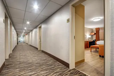 a corridor of a hospital hallway with a long hallway at Canadas Best Value Inn-Richmond Hill in Richmond Hill