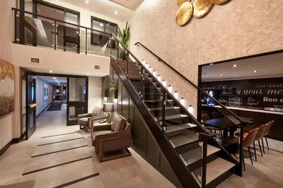 a staircase in a house with a lobby at Stay Inn Hotel Toronto in Toronto