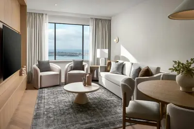 a living room with a couch and chairs and a table at The Westin Harbour Castle, Toronto in Toronto