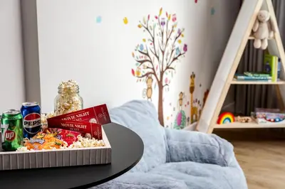 a box of popcorn and soda on a table at Sheraton Gateway Hotel in Toronto International Airport in Mississauga