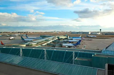 an airport with several airplanes parked on the tarmac at Sheraton Gateway Hotel in Toronto International Airport in Mississauga
