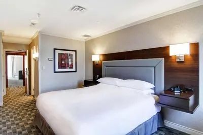 a large white bed in a hotel room at DoubleTree by Hilton Toronto Downtown in Toronto