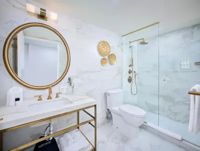 a bathroom with a sink toilet and a shower at Pantages Hotel Toronto Centre in Toronto