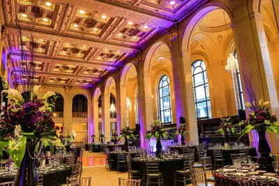 a banquet hall with tables and chairs in a building at One King West Hotel and Residence in Toronto