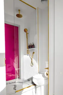 a bathroom with a toilet and a glass shower at Gladstone House in Toronto