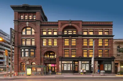 a brick building on the corner of a street at Gladstone House in Toronto