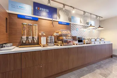 a coffee shop with a counter in a store at Holiday Inn Express & Suites Mississauga-Toronto Southwest by IHG in Mississauga