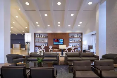 a lobby with couches and a waiting room at Hilton Mississauga/Meadowvale in Mississauga