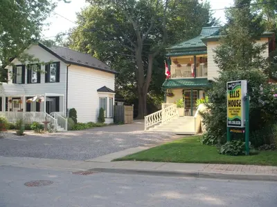 a house with a sign in front of it at Ellis House Bed & Breakfast in Niagara Falls