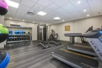 a fitness room with treadmills and cardio machines at Four Points by Sheraton Toronto Mississauga in Mississauga