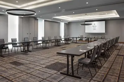 a conference room with a long table and chairs at Delta Hotels by Marriott Toronto Markham in Markham