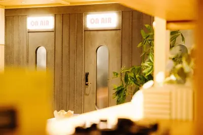 a reflection of a row of elevators in a locker room at Union Hotel in Toronto