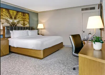 a hotel room with a bed and a desk at Crowne Plaza Toronto - North York by IHG in Toronto