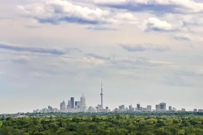 a view of the toronto skyline from the park at Crowne Plaza Toronto - North York by IHG in Toronto