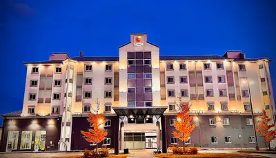 a large building with a clock on top of it at Comfort Hotel in Niagara Falls