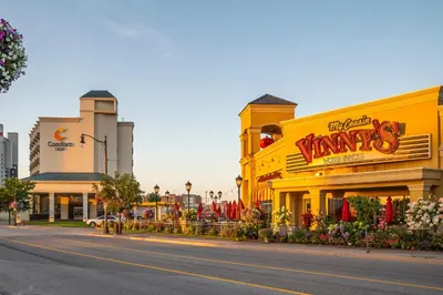 a street with a yellow building with a tampa sign at Comfort Inn Fallsview in Niagara Falls
