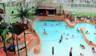 a group of people in a swimming pool at Americana Waterpark Resort & Spa in Niagara Falls
