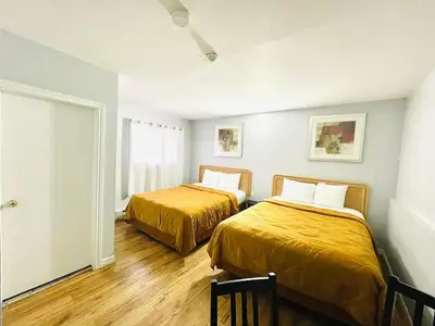 a room with two beds in a room at A1 Inn Niagara Falls in Niagara Falls
