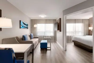 a hotel room with a couch and a bed at Embassy Suites By Hilton Toronto Airport in Toronto