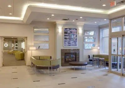 a lobby with a fireplace and a waiting room at Niagara Fallsview Hotel in Niagara Falls