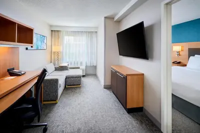 a hotel room with a bed and a desk at TownePlace Suites by Marriott Mississauga-Airport Corporate Centre in Mississauga