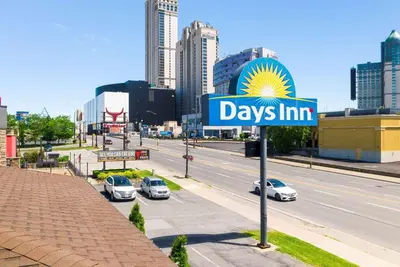 a sign for days inn on a city street at Days Inn by Wyndham Fallsview in Niagara Falls
