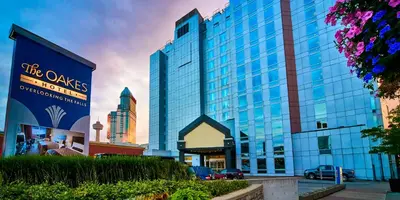 a large building with a sign in front of it at The Oakes Hotel Overlooking the Falls in Niagara Falls