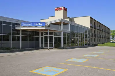 an empty parking lot in front of a hospital at Travelodge by Wyndham Richmond Hill in Richmond Hill