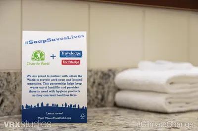 a sign in front of a pile of towels at Travelodge by Wyndham Richmond Hill in Richmond Hill