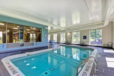 a large swimming pool in a building at Four Points by Sheraton St. Catharines Niagara Suites in Thorold