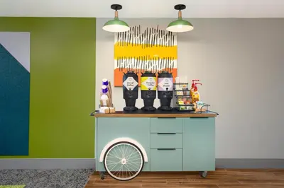 a cart with knives on top of it in a room at Spark by Hilton Toronto Airport in Toronto