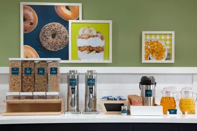 a counter with a counter top with different types of food at Spark by Hilton Toronto Airport in Toronto