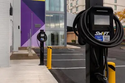 a pair of parking meters on the side of a street at Spark by Hilton Toronto Airport in Toronto