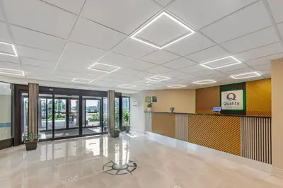 a large lobby with a waiting area in a building at Quality Inn & Suites in Brampton